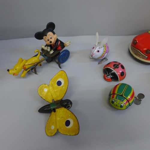 686 - Tin-plate toys including Mickey Mouse, Lehmann, a Japan made dodgem car, etc.