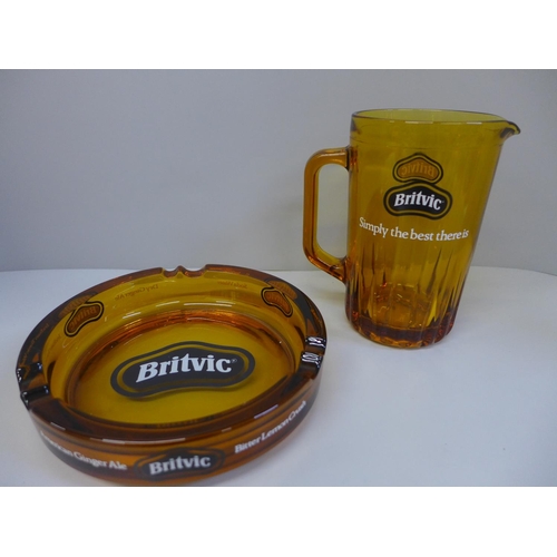 688 - Breweriana; a glass Britvic ash tray and jug