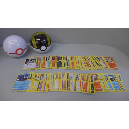 692 - 160 Pokemon holographic cards with two Pokeball tins