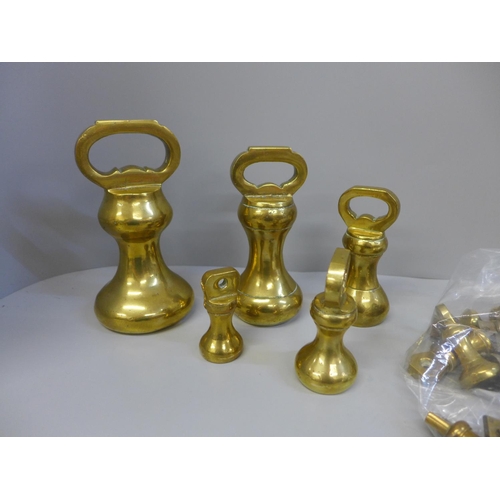 696 - A set of brass bell weights