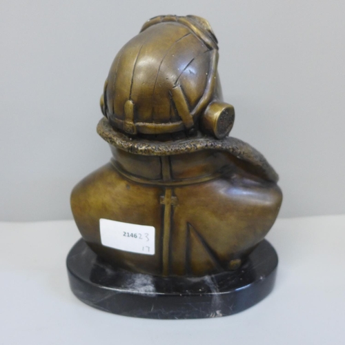 716 - A 20th Century bronze bust of a fighter pilot, signed RS on black marble base, 18.5cm