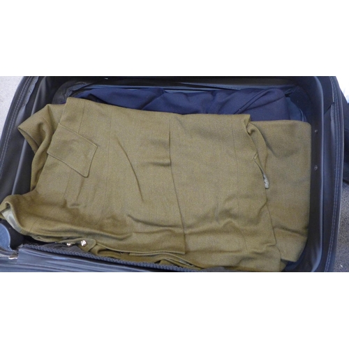 739 - A case containing two Royal Artillery uniforms