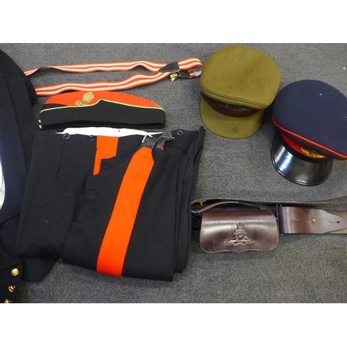 739 - A case containing two Royal Artillery uniforms