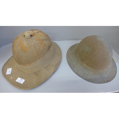 768 - A WWII Civilian Defence helmet and a Pith helmet