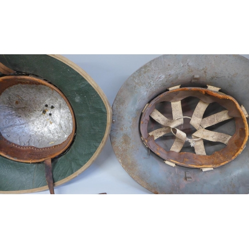 768 - A WWII Civilian Defence helmet and a Pith helmet