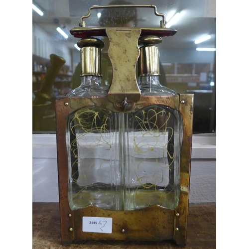 800 - An Edwardian two bottle tantalus, musical 'Little Brown Jug'   **PLEASE NOTE THIS LOT IS NOT ELIGIBL... 