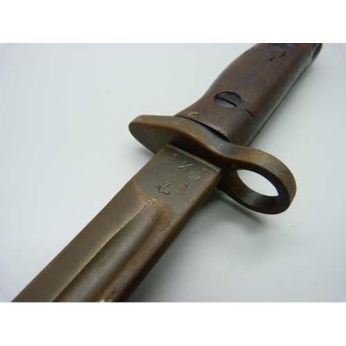 831 - A bayonet with scabbard