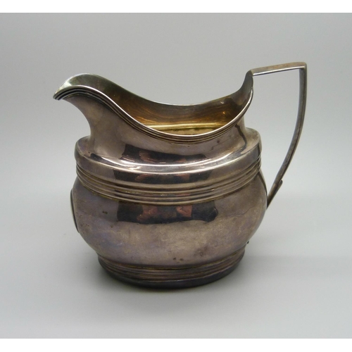 836 - A George III silver cream jug, London 1801, 144g, repaired