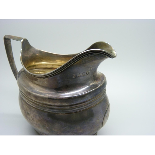 836 - A George III silver cream jug, London 1801, 144g, repaired