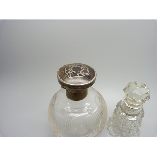 841 - A silver topped glass scent bottle, hinge a/f, a late Victorian silver mounted scent bottle, a Victo... 