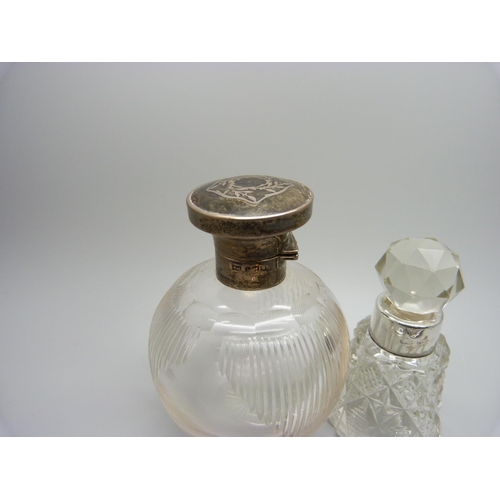 841 - A silver topped glass scent bottle, hinge a/f, a late Victorian silver mounted scent bottle, a Victo... 