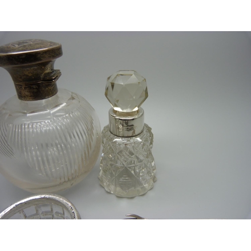 841 - A silver topped glass scent bottle, hinge a/f, a late Victorian silver mounted scent bottle, a Victo... 