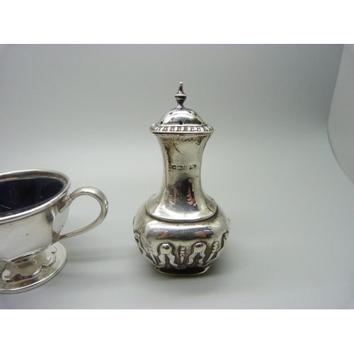 849 - A silver pepperette, a silver mounted glass mustard and a silver salt with blue glass liner, pepper ... 