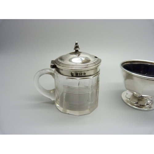 849 - A silver pepperette, a silver mounted glass mustard and a silver salt with blue glass liner, pepper ... 