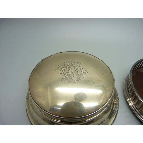 852 - A silver coaster and a silver vanity box with mirror in the lid, Birmingham 1924, (back of vanity a/... 