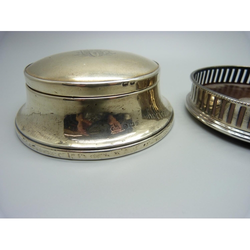 852 - A silver coaster and a silver vanity box with mirror in the lid, Birmingham 1924, (back of vanity a/... 