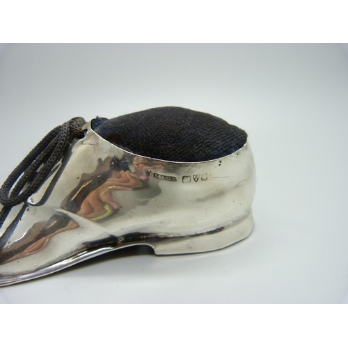 858 - A novelty silver shoe pin cushion, worn Chester hallmark, 12cm