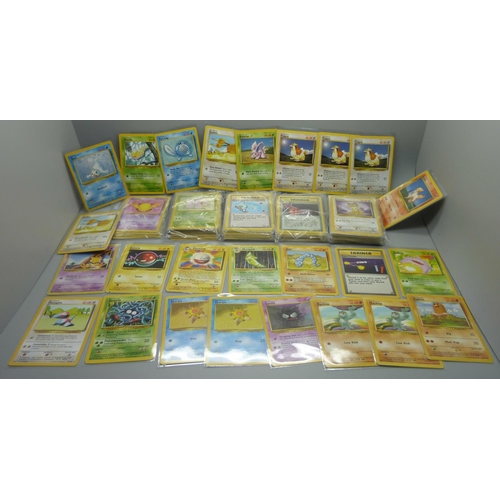 859 - 166 Pokemon cards, 57 base set, 67 jungle set, 31 fossil set and 11 team rocket set