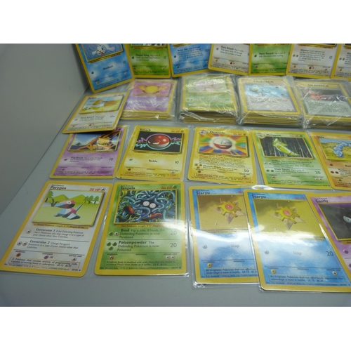 859 - 166 Pokemon cards, 57 base set, 67 jungle set, 31 fossil set and 11 team rocket set