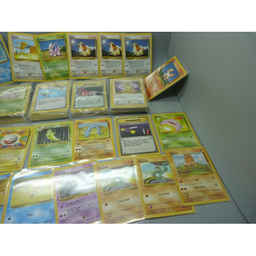 859 - 166 Pokemon cards, 57 base set, 67 jungle set, 31 fossil set and 11 team rocket set