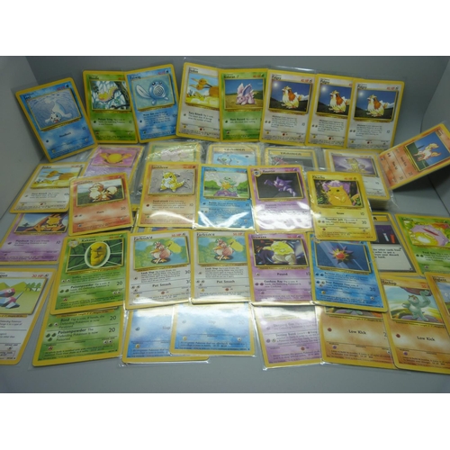 859 - 166 Pokemon cards, 57 base set, 67 jungle set, 31 fossil set and 11 team rocket set