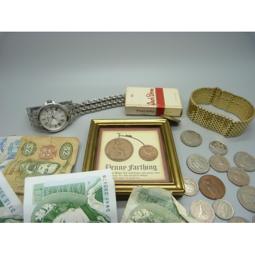 862 - A Rotary wristwatch, a bracelet, coins and banknotes