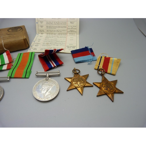 872 - A collection of five WWII medals, box addressed to Quinn, Manchester