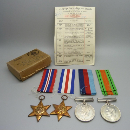 881 - Four WWII medals, box addressed to Lawrence, Manchester