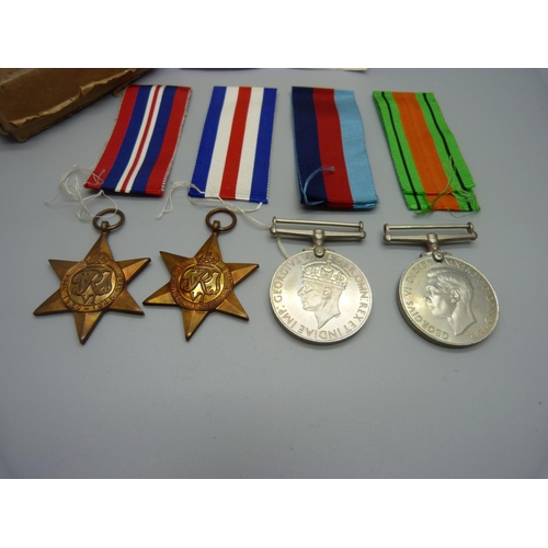 881 - Four WWII medals, box addressed to Lawrence, Manchester