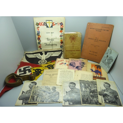 883 - A collection of WWII period military items, including three German cross medals, a German anti-aircr... 