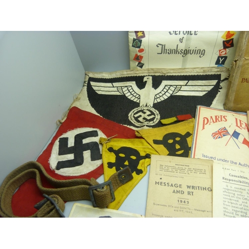 883 - A collection of WWII period military items, including three German cross medals, a German anti-aircr... 