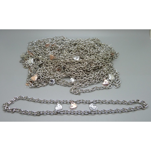 890 - A collection of approximately thirty-four Fiorelli designer chain necklaces with hearts