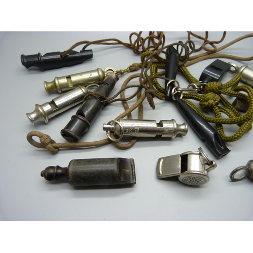 891 - A collection of thirteen whistles including Acme, ARP, Metropolitan and carved horn,