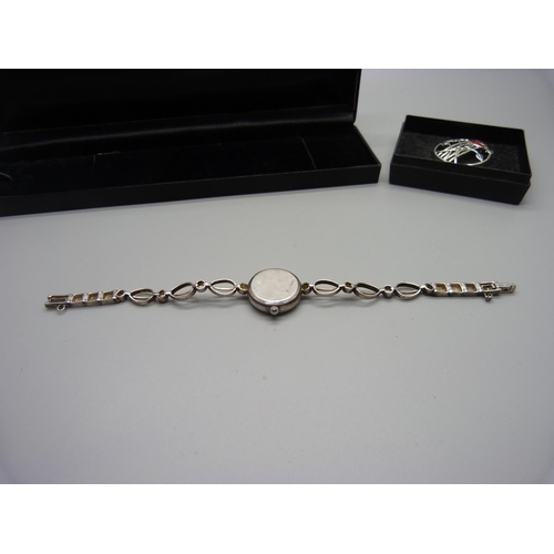 892 - A silver Rennie Mackintosh wristwatch and a brooch