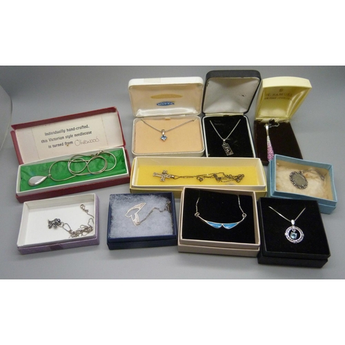 898 - Ten silver pendants and chains