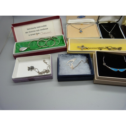 898 - Ten silver pendants and chains