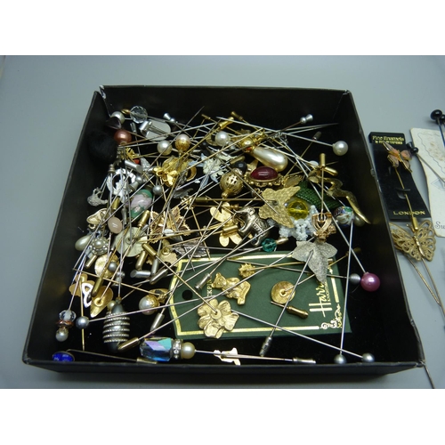 905 - A collection of costume hat pins and stick pins