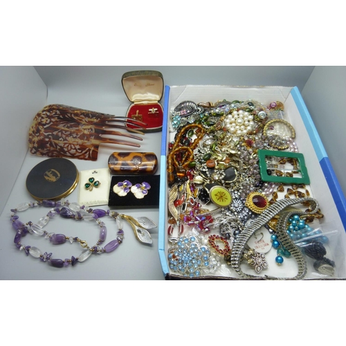 910 - A collection of costume jewellery and other items including a compact