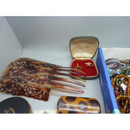 910 - A collection of costume jewellery and other items including a compact