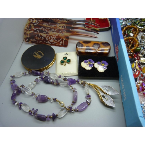 910 - A collection of costume jewellery and other items including a compact