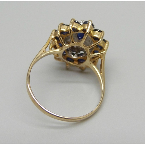 913 - A 9ct gold, sapphire and diamond cluster ring, 3.7g, P