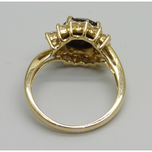 916 - A gold, sapphire and CZ ring, 3.8g, L