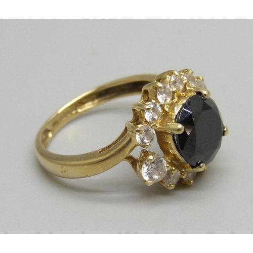 916 - A gold, sapphire and CZ ring, 3.8g, L