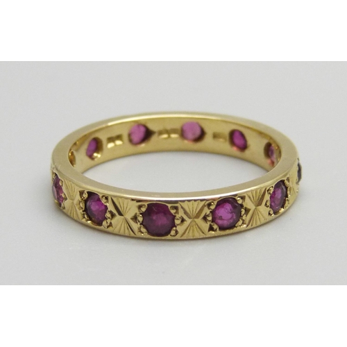 917 - An 18ct gold and ruby eternity ring, 4.2g, P