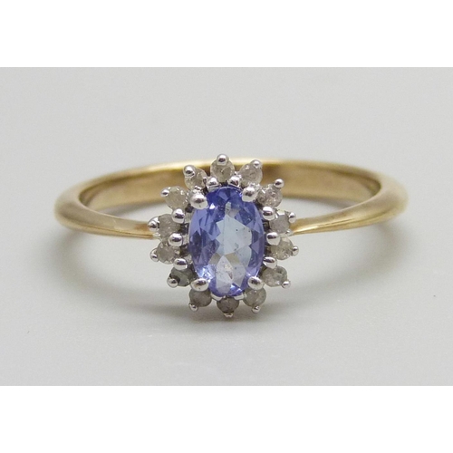 920 - A 9ct gold, tanzanite and diamond cluster ring, 2.1g, P