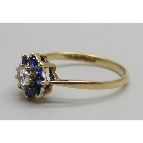 925 - A 9ct gold, blue and white stone cluster ring, 1.6g, N