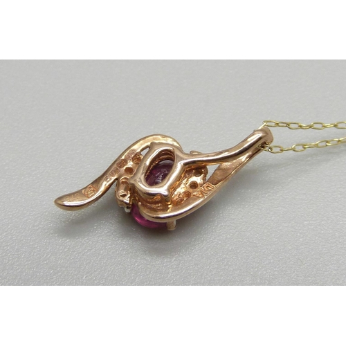 933 - A 9ct gold, ruby and diamond pendant on chain, 1.2g