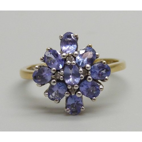 935 - A silver gilt, tanzanite and diamond cluster ring, N