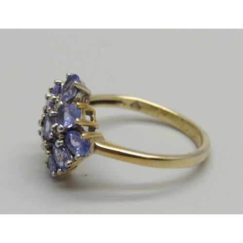 935 - A silver gilt, tanzanite and diamond cluster ring, N