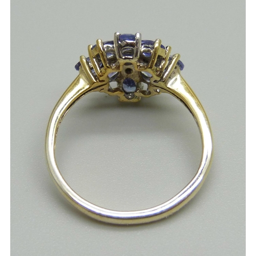 935 - A silver gilt, tanzanite and diamond cluster ring, N